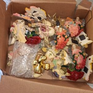 Box of angelic antique statues.